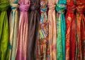 Assorted colour silk scarves laid out