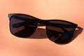 Black oversized square sunglasses on white surface
