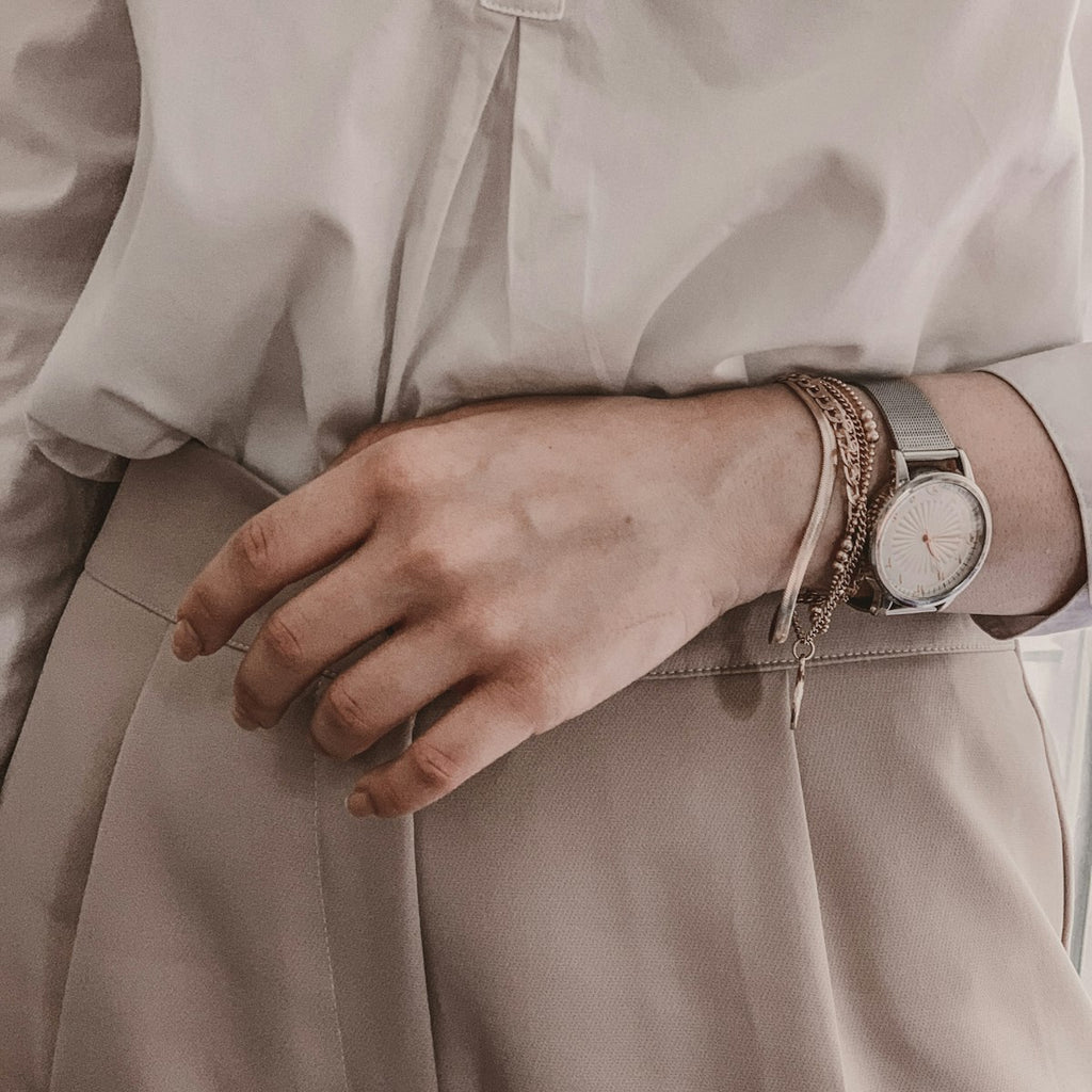 Silver mesh strap watch on wrist