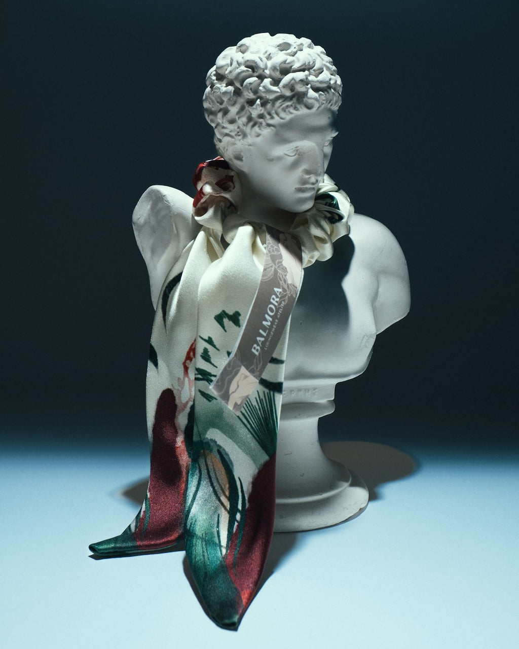 Colourful scarf draped on a fashion bust